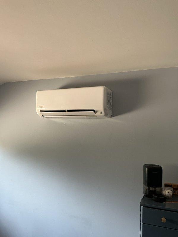 Completed installation of two air conditioning systems and one ductless mini-split unit at residential property. Mounted outdoor mini-split condenser unit on exterior wall using bracket system, installed refrigerant line set with PVC line hide, and ran electrical conduit to disconnect box. Interior mini-split air handler installed on wall near ceiling with proper refrigerant connections, condensate drainage, and electrical wiring. All units tested for proper operation, refrigerant charge verified, and system performance confirmed to manufacturer specifications.