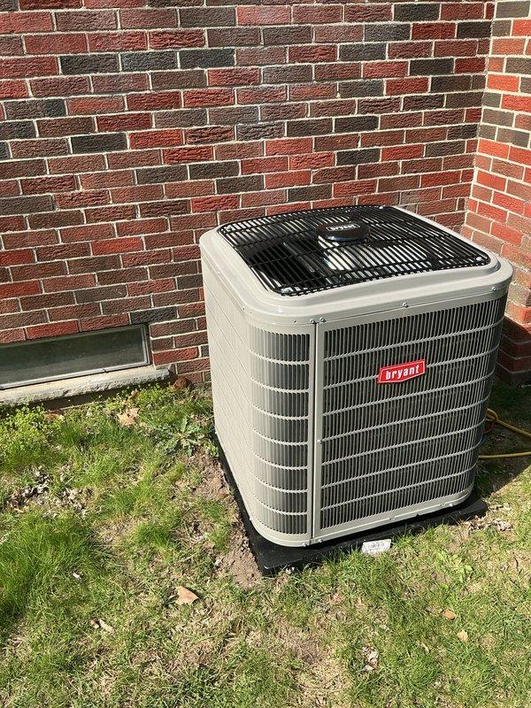 Completed full HVAC system installation including new Bryant furnace and air conditioning unit at residential property. Positioned outdoor condensing unit on concrete pad with proper clearance from building structure, installed PVC condensate drain lines and venting through exterior wall, and established all necessary electrical connections. All equipment tested and operational upon completion.