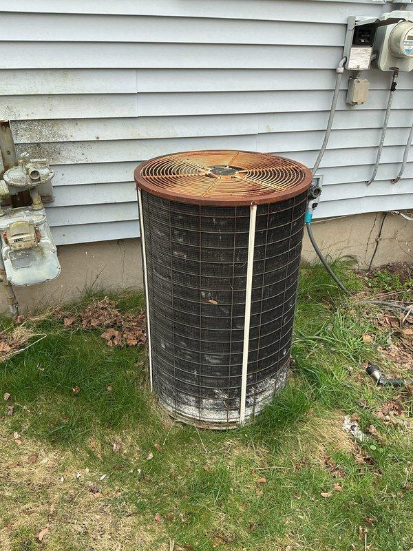 Completed annual AC maintenance and cleaning on outdoor condenser unit in preparation for seasonal renewal. Performed thorough inspection of unit exterior, noting significant corrosion and weathering on lower sections of cabinet and metal surfaces due to extended environmental exposure. Customer requested furnace maintenance to be scheduled for fall season.