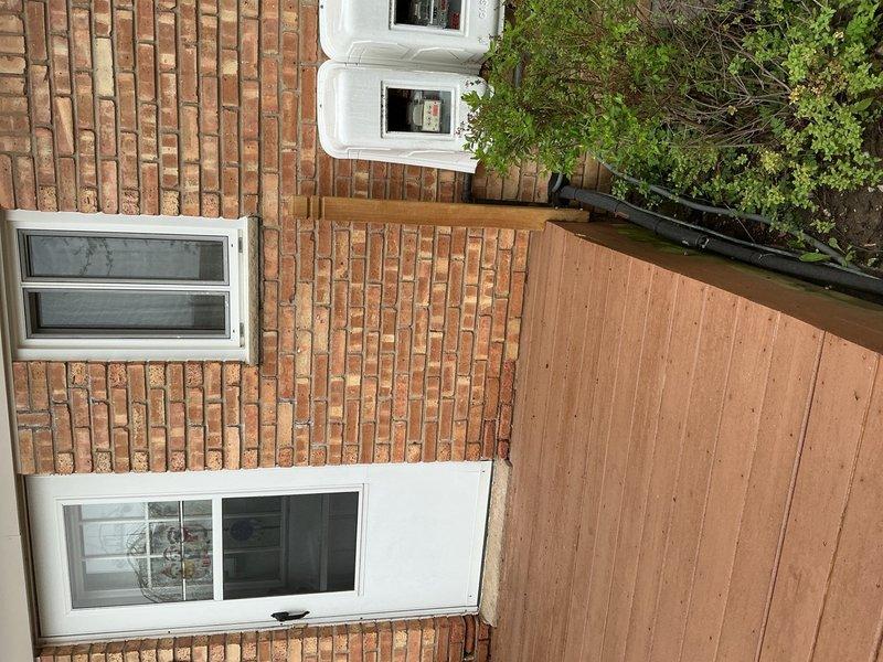 Responded to recurring annual freeze-up issue on residential air conditioning system. Upon arrival, inspected outdoor condensing unit and refrigerant lines for restrictions, debris buildup, and airflow obstructions. Evaluated system for potential causes including low refrigerant charge, restricted airflow, or mechanical failures contributing to coil icing. Documented equipment condition and installation location beneath elevated deck structure. System assessed and photographed for service records.