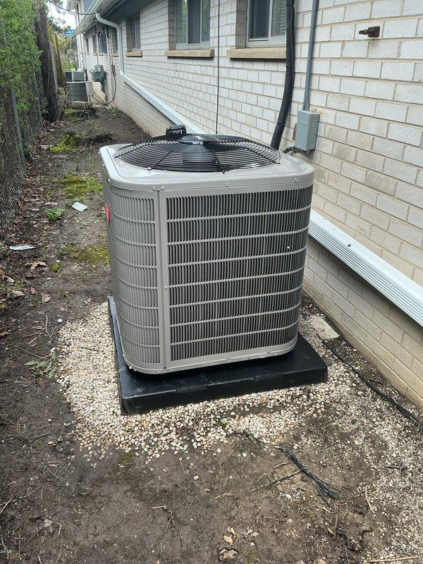 Completed installation of Bryant Preferred Series complete HVAC system including new furnace and air conditioning condenser unit. The furnace was installed in the basement utility area with proper venting, electrical connections via flexible and rigid conduit, and integrated ductwork connections to the existing air distribution system. The outdoor condensing unit was positioned on a level pad with gravel base against the building exterior, with refrigerant lines and electrical service routed through the wall and properly secured. All equipment was installed per manufacturer specifications, electrical connections were made to code, and the system was tested for proper operation.