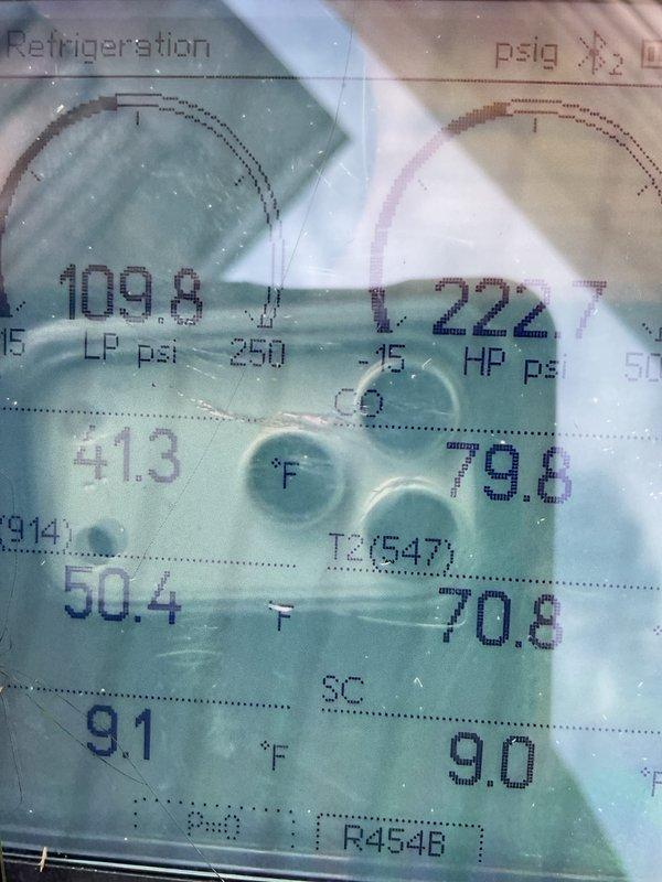 Completed system start-up and commissioning for newly installed mobile home HVAC system consisting of gas furnace and air conditioning unit. Verified proper refrigerant charge using R454B refrigerant with system operating at 109.8 psi low side and 22.7 psi high side pressures, subcooling measured at 9.1°F within manufacturer specifications. Confirmed outdoor condensing unit properly installed on ground-level pad with appropriate clearances, electrical disconnect box mounted and operational, refrigerant line sets properly insulated and secured to structure, and all system components functioning as designed.