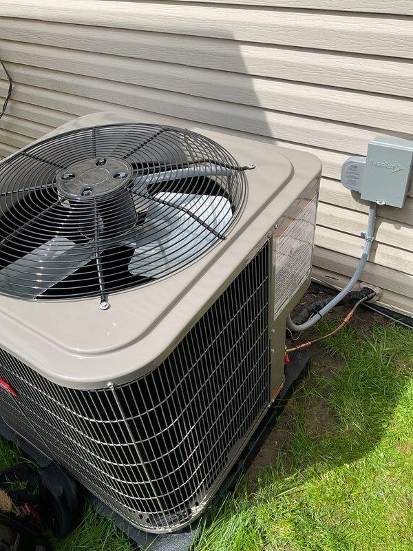 Completed system start-up and commissioning for newly installed mobile home HVAC system consisting of gas furnace and air conditioning unit. Verified proper refrigerant charge using R454B refrigerant with system operating at 109.8 psi low side and 22.7 psi high side pressures, subcooling measured at 9.1°F within manufacturer specifications. Confirmed outdoor condensing unit properly installed on ground-level pad with appropriate clearances, electrical disconnect box mounted and operational, refrigerant line sets properly insulated and secured to structure, and all system components functioning as designed.