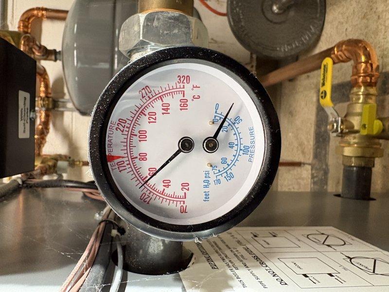 Completed comprehensive boiler tune-up and annual maintenance inspection. System pressure gauge readings were verified and documented, showing normal operating parameters within manufacturer specifications. All copper piping connections, pressure relief valves, and shut-off valves were inspected for proper operation and potential leaks, with no issues identified. Service renewal was processed and next maintenance appointment was scheduled.