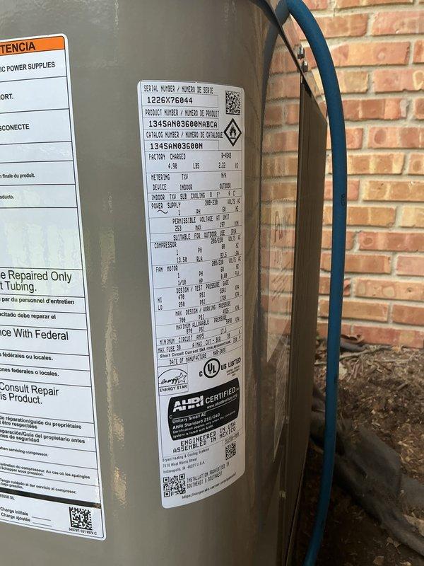 Completed installation of new air conditioning condenser unit and evaporator coil system. The outdoor condenser unit was professionally mounted on a concrete pad against the exterior brick wall with proper electrical connections and refrigerant lines installed, while the indoor evaporator coil was integrated with the existing furnace system in the basement utility area. All components were tested for proper operation, refrigerant charge verified, and system confirmed to be cooling efficiently per manufacturer specifications.