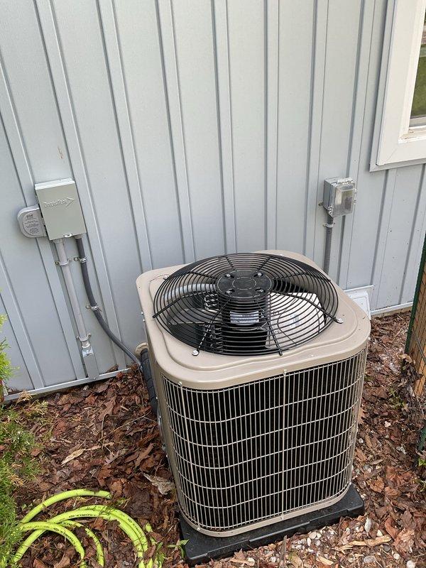 Completed full HVAC system installation including new furnace and air conditioning condenser unit. Upgraded electrical panel to support new equipment and installed proper disconnect boxes with conduit routing along exterior wall. Positioned AC condenser on concrete pad against building exterior with proper clearances, connected refrigerant lines and electrical service, and performed system startup procedures. All equipment tested and operating within manufacturer specifications.