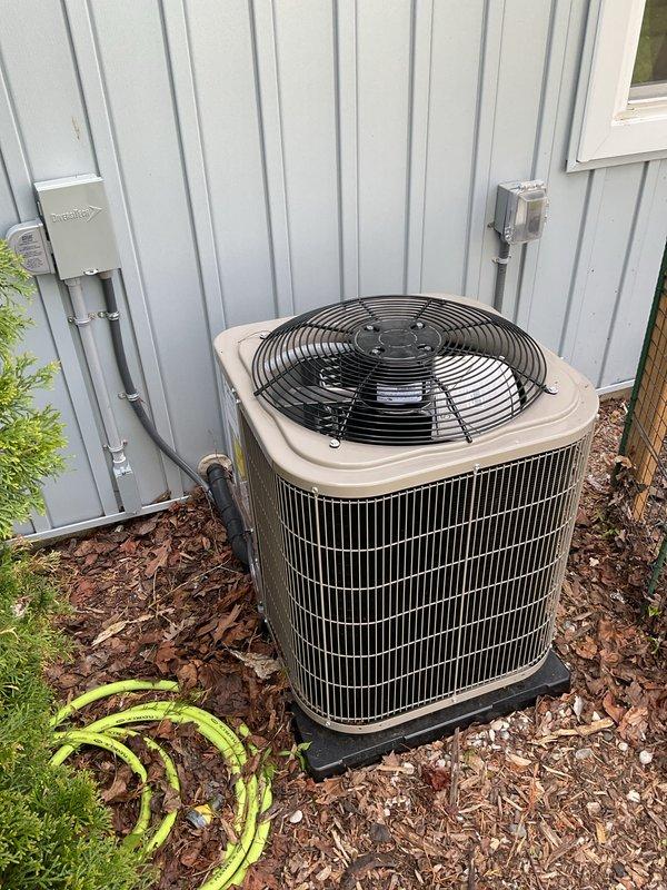 Completed full HVAC system installation including new furnace and air conditioning condenser unit. Upgraded electrical panel to support new equipment and installed proper disconnect boxes with conduit routing along exterior wall. Positioned AC condenser on concrete pad against building exterior with proper clearances, connected refrigerant lines and electrical service, and performed system startup procedures. All equipment tested and operating within manufacturer specifications.