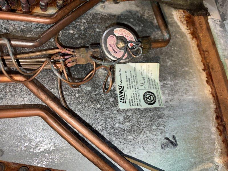 Completed scheduled AC tune-up and cooling system maintenance. Inspected refrigerant lines, electrical connections, and control components in attic installation; all copper piping and terminal connections found secure with normal operational wear. System tested and confirmed operating within manufacturer specifications for cooling season.