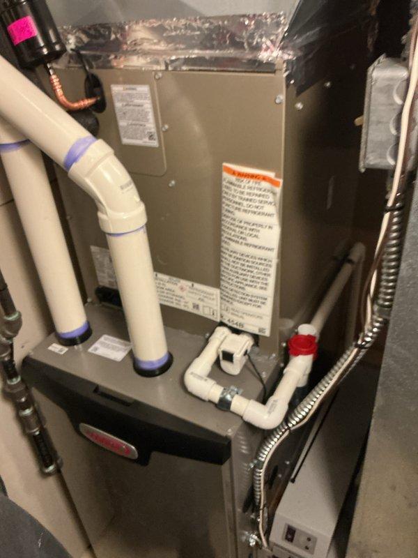 Completed installation of new Bryant air conditioning system with matching evaporator coil. Installed indoor air handler unit in mechanical closet with proper clearances for service access, including new condensate drain lines with PVC piping and appropriate trap configuration. Mounted outdoor condenser unit on level pad against exterior wall with proper refrigerant line sets and electrical connections. Connected flexible ductwork to air handler for distribution system integration. Installed electrical disconnect and wiring per code requirements. Verified all connections, tested system operation, and confirmed proper airflow and cooling performance.
