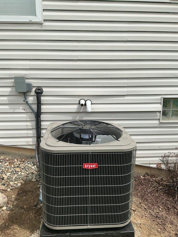 Completed installation of new Bryant air conditioning system with matching evaporator coil. Installed indoor air handler unit in mechanical closet with proper clearances for service access, including new condensate drain lines with PVC piping and appropriate trap configuration. Mounted outdoor condenser unit on level pad against exterior wall with proper refrigerant line sets and electrical connections. Connected flexible ductwork to air handler for distribution system integration. Installed electrical disconnect and wiring per code requirements. Verified all connections, tested system operation, and confirmed proper airflow and cooling performance.