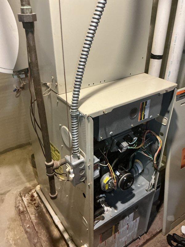 Completed comprehensive AC tune-up and preventive maintenance service on residential HVAC system. Performed full system inspection including furnace cabinet, blower motor assembly, electrical connections, and ductwork. All components found to be in proper working condition with no issues identified during inspection.