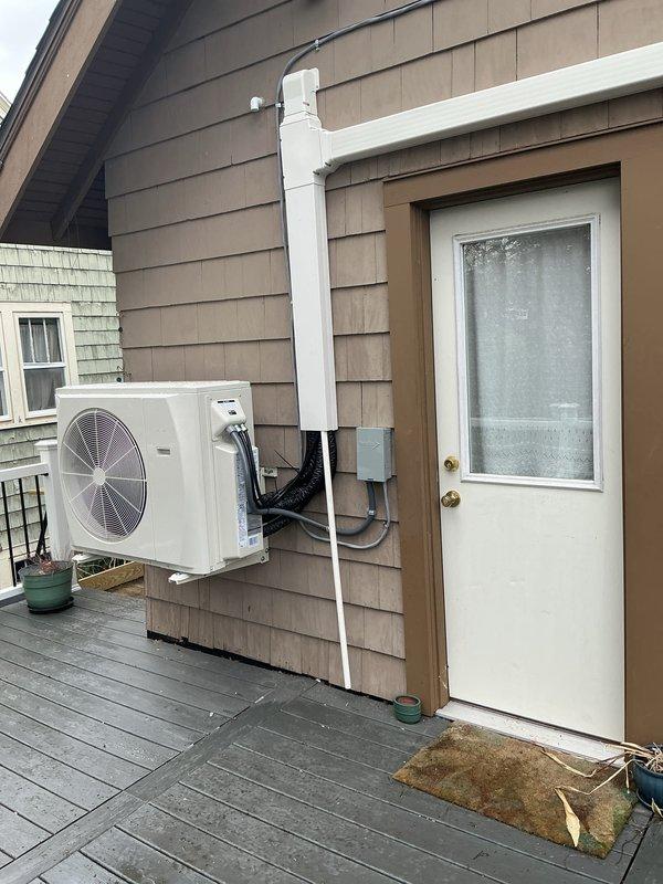 Completed installation of a 2-zone ductless mini-split heat pump system at residential property. Mounted outdoor condenser unit on exterior wall with proper clearances and secured refrigerant line set along building facade using appropriate fasteners and protective covering. Installed indoor wall-mounted air handler units in two separate zones, ensuring proper placement for optimal airflow distribution and aesthetic integration with existing interior spaces. Ran electrical connections to exterior junction box and completed all refrigerant line connections between outdoor and indoor units. System was pressure tested, evacuated, and charged to manufacturer specifications. Performed full operational testing of both zones to verify heating and cooling functions, confirming proper communication between indoor units and outdoor condenser.