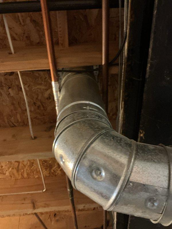 Installed a 50-gallon Bradford White gas water heater in basement utility room, including all necessary connections and safety components. Connected copper supply lines with brass fittings and valves to the top of the unit, installed blue expansion tank on the right side with proper copper piping connections, and ensured pressure relief valve was properly installed with appropriate discharge piping. All plumbing connections were secured and tested for proper operation and leak-free performance per manufacturer specifications and local code requirements.