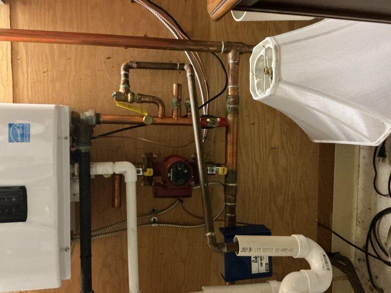 Performed comprehensive AC maintenance on residential system per customer concern regarding inadequate cooling performance. Completed full system inspection including visual assessment of HVAC equipment, Navien heating unit, plumbing connections, and associated mechanical components. Documented equipment condition with photographic records showing proper installation of copper and PEX plumbing lines, circulator pump operation, water heater configuration, and overall system integration. Scheduled maintenance renewal to ensure continued system performance and efficiency.
