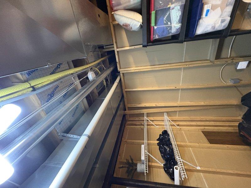 Responded to water leak reported beneath ground floor air handler unit installed in 2018. Upon inspection, identified source of water accumulation in utility area. Documented existing HVAC system configuration including air handler, ductwork connections, and drainage components to assess leak origin and determine appropriate corrective action under parts warranty coverage.