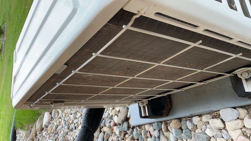 Performed comprehensive air conditioning tune-up on outdoor condensing unit. Inspected unit exterior, coil condition, and mounting hardware; verified proper airflow through condenser grille and confirmed unit operational status. Collected payment for service agreement renewal and documented equipment condition with photographs.