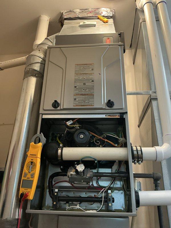 Completed comprehensive maintenance tune-ups on both air conditioning and gas furnace systems. The AC unit appears to be newer equipment in good condition, while the gas furnace is an older model that was thoroughly inspected and serviced. All components were tested, filters checked, and system operations verified to ensure proper performance for the upcoming season.