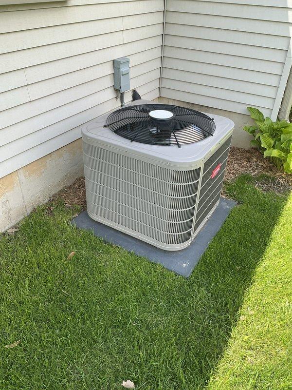 Performed comprehensive air conditioning tune-up and preventive maintenance on residential outdoor condensing unit. System inspected, tested, and confirmed operating within normal parameters with no deficiencies noted. Unit found in good condition with proper airflow through coil fins and fan assembly functioning correctly.