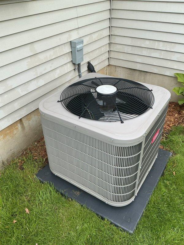 Performed comprehensive air conditioning tune-up and preventive maintenance on residential outdoor condensing unit. System inspected, tested, and confirmed operating within normal parameters with no deficiencies noted. Unit found in good condition with proper airflow through coil fins and fan assembly functioning correctly.