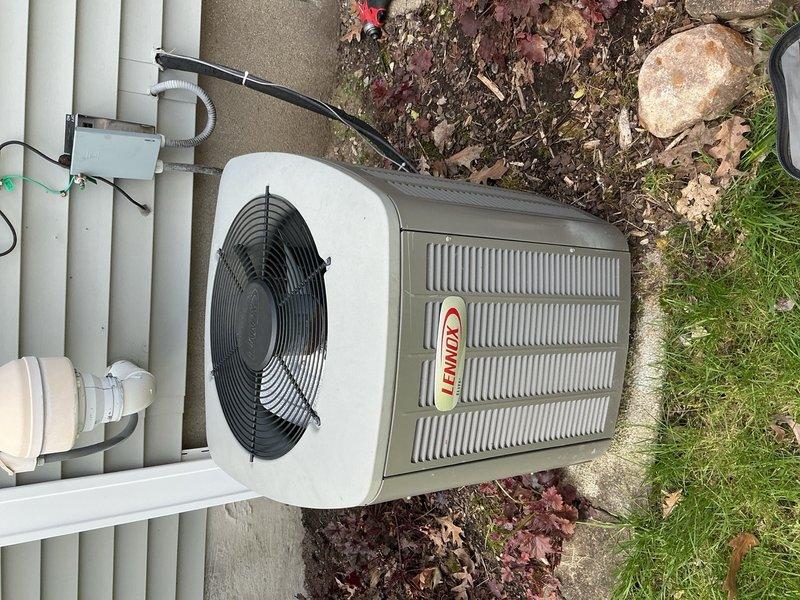 Completed scheduled AC tune-up on Lennox condenser unit. Performed comprehensive system inspection, collected equipment information, and documented unit condition with access panel opened to verify electrical connections and internal components. All standard maintenance procedures were executed per manufacturer specifications, and unit was secured and left in proper operating condition.