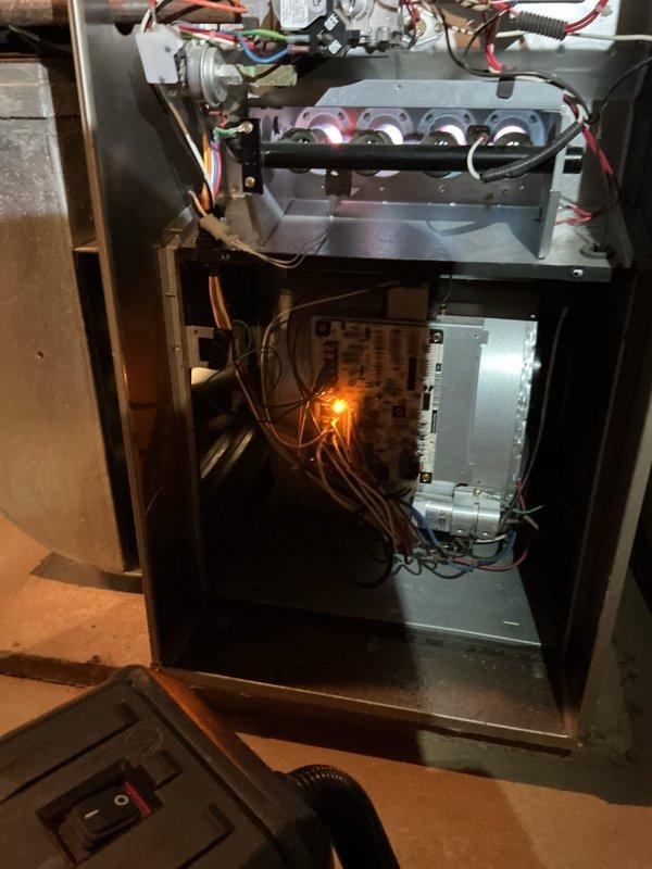 Completed routine HVAC furnace maintenance including thorough cleaning of the unit and internal components. Inspected gas valve assembly, blower motor, control board, and all electrical connections, confirming all systems operational with no issues detected. Photographed equipment condition for service records.