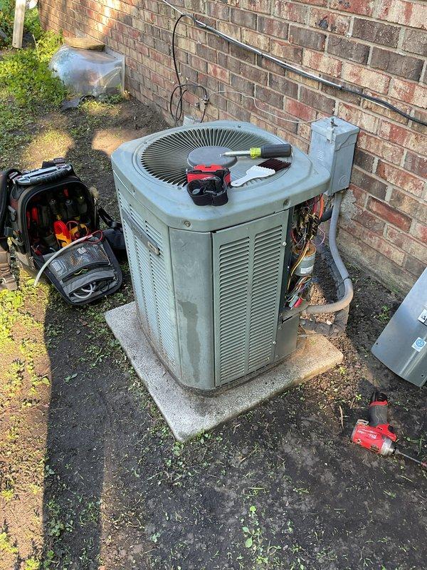 Completed preventive maintenance tune-up on outdoor R22 condensing unit. Performed comprehensive system inspection, cleaned condenser coils, checked refrigerant levels, tested electrical connections and disconnect box, and verified proper operation of all components. System is functioning within normal parameters but homeowner was advised that replacement may be needed within the next year due to age and R22 refrigerant phase-out considerations.