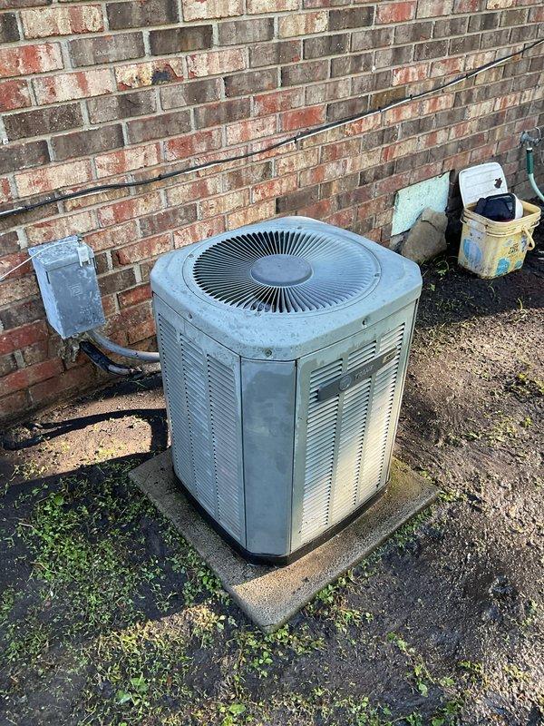 Completed preventive maintenance tune-up on outdoor R22 condensing unit. Performed comprehensive system inspection, cleaned condenser coils, checked refrigerant levels, tested electrical connections and disconnect box, and verified proper operation of all components. System is functioning within normal parameters but homeowner was advised that replacement may be needed within the next year due to age and R22 refrigerant phase-out considerations.