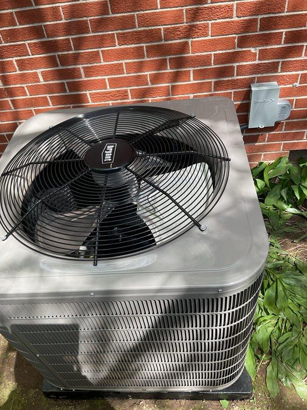 Completed installation of new Bryant air conditioning system including outdoor condensing unit and indoor evaporator coil. Outdoor unit was positioned on pad against exterior brick wall with proper clearances, electrical disconnect box mounted, and refrigerant lines connected. Indoor evaporator coil was installed above existing Bryant furnace in basement mechanical room, integrated with existing ductwork and plenum system. All refrigerant lines were run, system was evacuated, charged to manufacturer specifications, and tested for proper operation. Electrical connections completed to code, condensate drainage configured with PVC piping, and all safety controls verified functional.