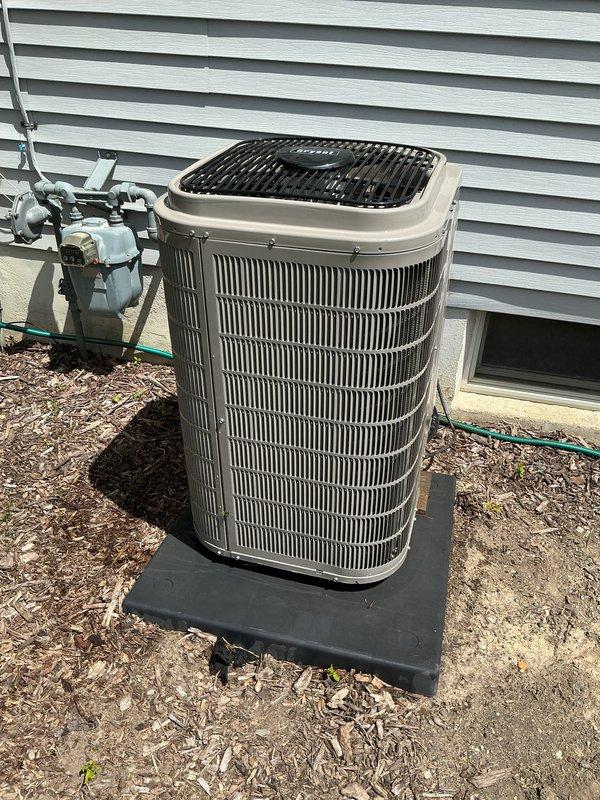 Completed comprehensive air conditioning tune-up on outdoor condenser unit. Performed full system inspection, cleaned condenser coils, checked refrigerant levels, tested electrical connections and capacitor, verified proper airflow through fan assembly, and ensured disconnect box functionality. Unit operating within manufacturer specifications with no issues identified.