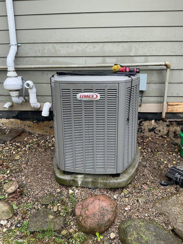 Completed comprehensive air conditioning tune-up and preventive maintenance on Lennox outdoor condenser unit. Performed standard maintenance procedures including inspection of refrigerant lines, electrical connections, and fan assembly; noted significant algae growth on concrete pad and debris accumulation on fan guard that will require attention during future service visits. Equipment list requires clarification regarding second AC unit mentioned in work order.