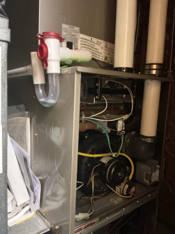 Completed comprehensive multi-system tune-up including air conditioning unit, gas furnace, and water heater. Performed full system diagnostics on outdoor condensing unit with refrigerant pressure testing using digital manifold gauges, verified proper operation of condenser fan and compressor, and inspected all electrical connections. Conducted indoor air handler inspection, checked condensate drain trap functionality and drainage flow, and verified blower motor operation. Extended service agreement coverage was established for the water heater to ensure continued maintenance and protection.