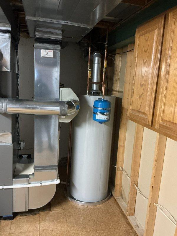 Completed installation of a new gas-fired tanked water heater in the utility room, including all necessary connections for gas supply, cold water inlet, and hot water outlet using copper piping and brass fittings. Installed and properly mounted an expansion tank to the system to protect against thermal expansion and maintain optimal pressure levels. Verified all connections for proper operation, ensured compliance with local plumbing codes, and confirmed the unit is functioning safely and efficiently.