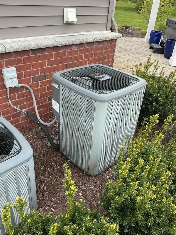 Completed membership air conditioning tune-up service on dual outdoor condensing units. Performed comprehensive preventive maintenance inspection including cleaning condenser coils, checking refrigerant levels, testing electrical connections, verifying proper airflow through fan assemblies, and ensuring all safety disconnects were functioning correctly. Both units operating within normal parameters with no deficiencies noted at time of service.
