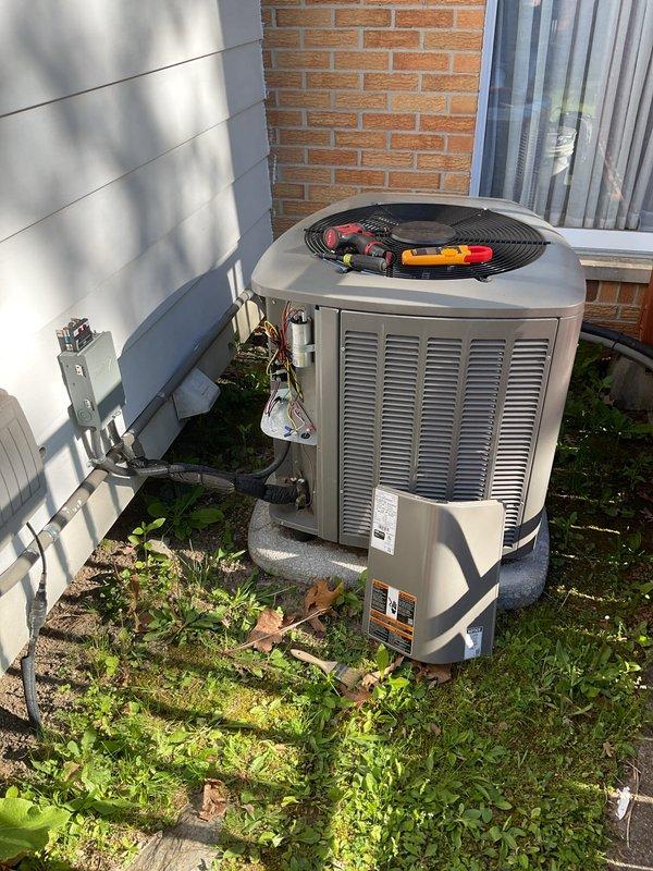 Completed comprehensive AC tune-up on Lennox EL17XC1 outdoor condensing unit containing R-410A refrigerant. Performed standard maintenance procedures including system diagnostics with multimeter, inspection of electrical connections and disconnect box, verification of manufacturer specifications, and assessment of unit operation. Membership renewal required for continued service coverage.