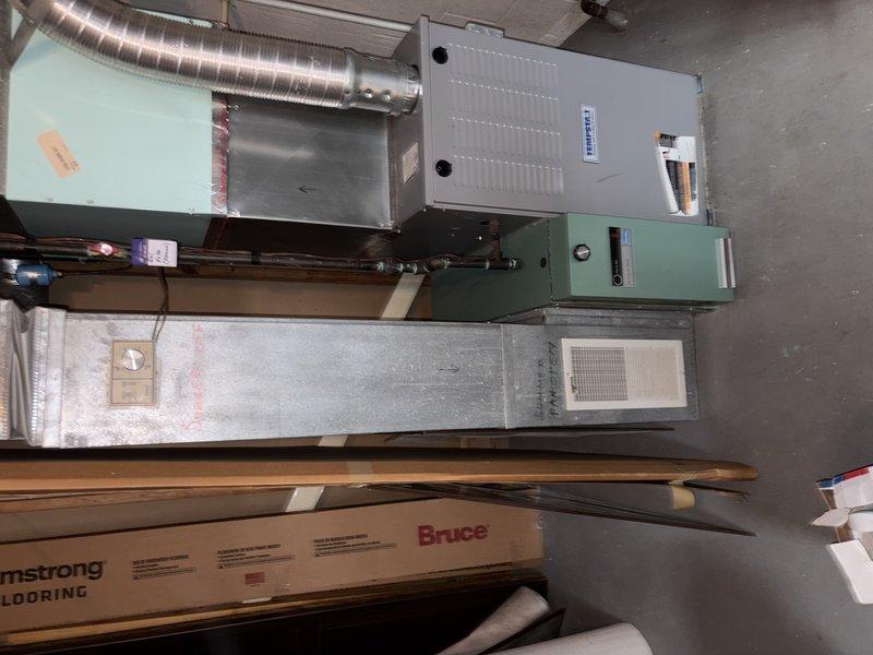 Responded to service call for non-functional humidifier system. Upon inspection, found humidifier unit severely rusted and inoperable, requiring replacement. Documented existing HVAC system configuration including furnace, evaporator coil, and ductwork connections for service records.