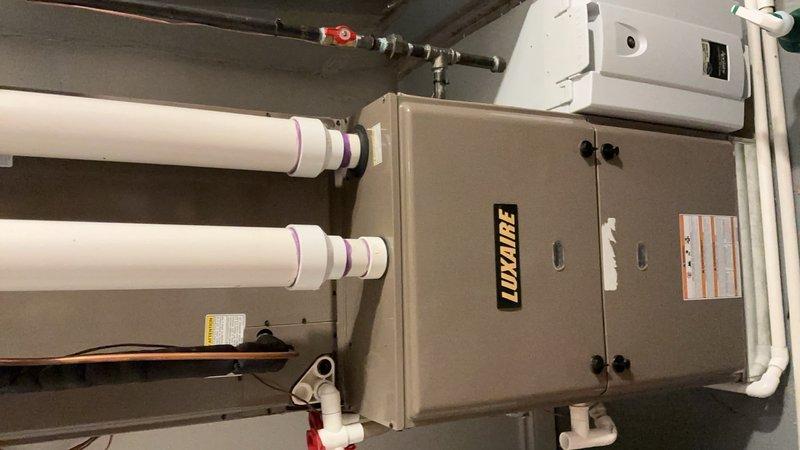 Completed comprehensive maintenance inspection on multi-system HVAC equipment including Luxaire gas furnace and air handler unit. Performed thorough examination of air handler internal components, inspecting blower motor assembly, electrical connections, and wiring harnesses for proper operation and secure connections. Verified condensate drain lines are clear and functioning properly. Inspected gas furnace cabinet, venting system including PVC intake/exhaust pipes with proper coupling connections, and confirmed gas line shut-off valve accessibility. Verified electrical disconnect switch operation and all safety controls. All equipment found to be operating within normal parameters with no immediate service needs identified. System maintenance renewal collected at time of service.