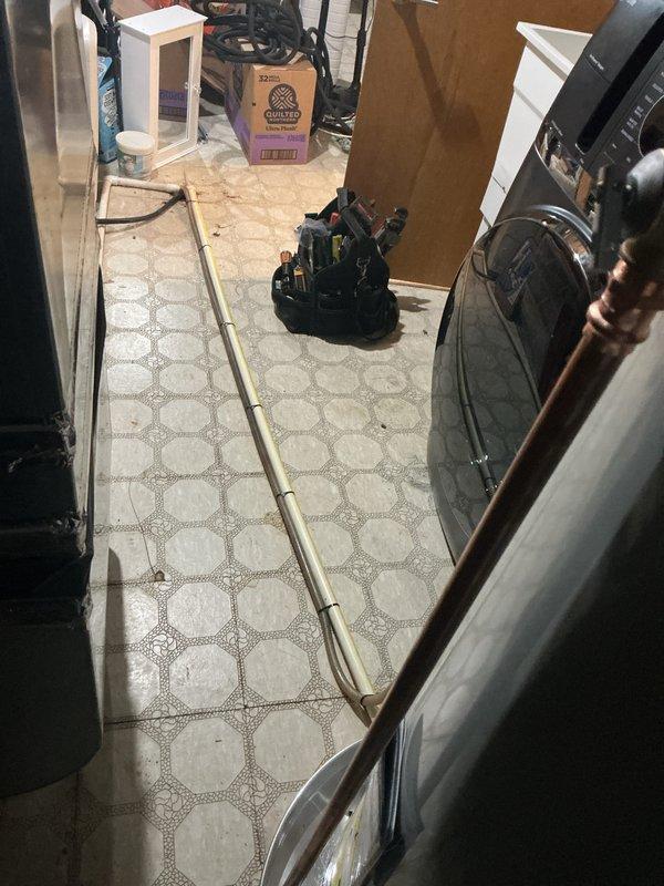 Completed installation of 50-gallon tanked water heater in utility room. Connected supply and discharge lines using copper piping with proper fittings and secured all lines to wall with appropriate mounting brackets. Installed insulated pipe runs and pressure relief valve assembly, ensuring all connections meet code requirements and system is operational.