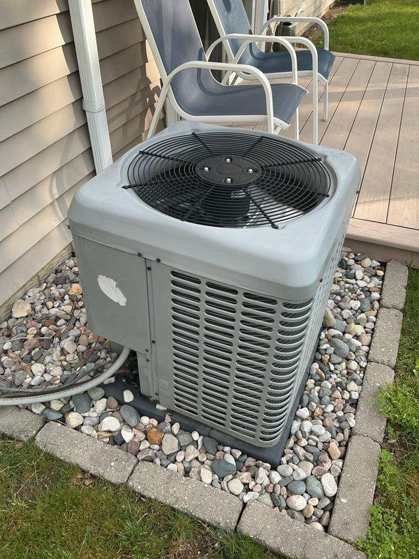 Completed annual AC tune-up and preventative maintenance on three outdoor Luxaire condenser units installed at residential property. Performed comprehensive system inspection, verified proper operation of all units, and documented equipment condition with photographs showing units in good working order with clean installations on rock beds.