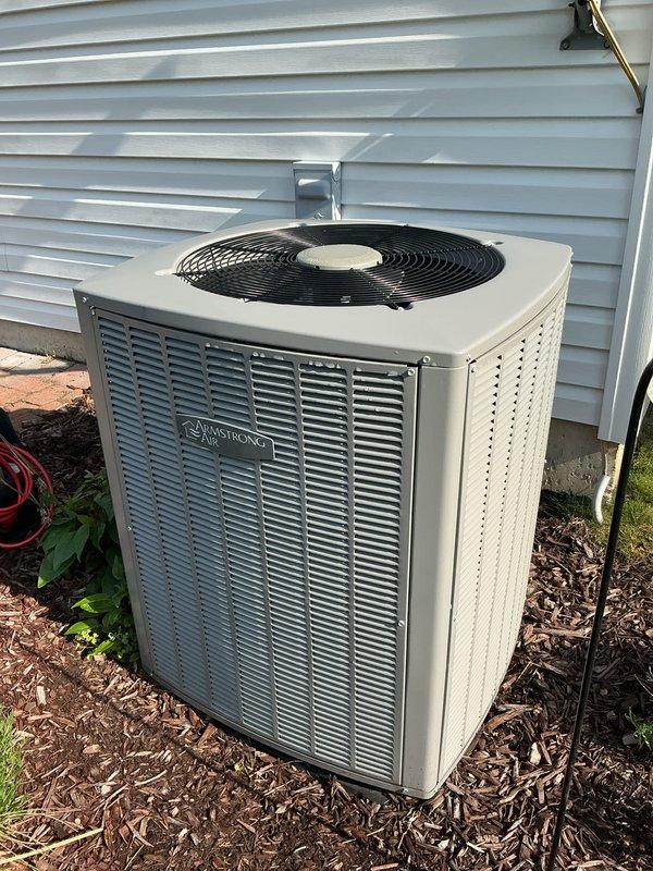 Completed annual air conditioning tune-up service on Armstrong outdoor condenser unit and indoor air handler system. Performed comprehensive system inspection, verified proper operation of all components including evaporator coils and condenser fan assembly, and documented equipment condition with photographs for maintenance records.