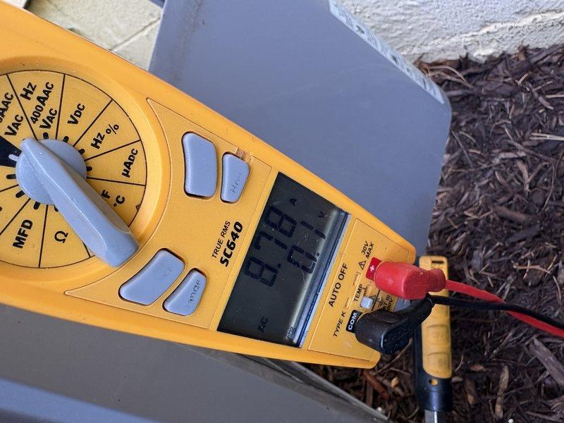 Performed comprehensive AC tune-up and system evaluation. Conducted electrical diagnostics using digital multimeter, measuring amperage draw and voltage readings at outdoor condensing unit to verify proper compressor operation and electrical performance within manufacturer specifications. All measurements indicated normal system operation with no electrical anomalies detected.