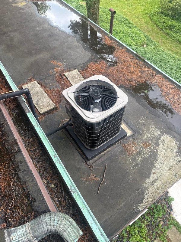 Completed full HVAC system installation including outdoor condensing unit positioned on rooftop platform with proper mounting pad and drainage considerations. Installed and connected all necessary refrigerant lines, condensate drainage components, and electrical connections per manufacturer specifications, ensuring system is fully operational and ready for service.