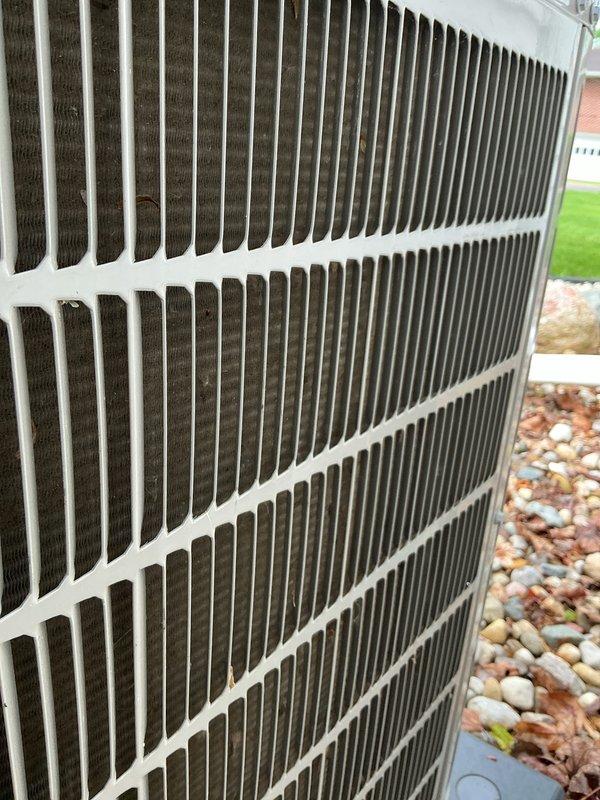 Completed annual air conditioning tune-up on Bryant outdoor condenser unit. Performed standard maintenance protocol including inspection of condenser coils, fan operation, electrical connections, and refrigerant levels. Unit found in good operating condition with normal seasonal dirt accumulation on exterior fins; all components functioning properly.