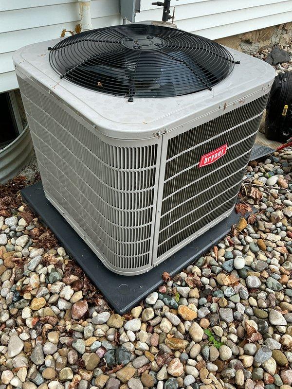 Completed annual air conditioning tune-up on Bryant outdoor condenser unit. Performed standard maintenance protocol including inspection of condenser coils, fan operation, electrical connections, and refrigerant levels. Unit found in good operating condition with normal seasonal dirt accumulation on exterior fins; all components functioning properly.
