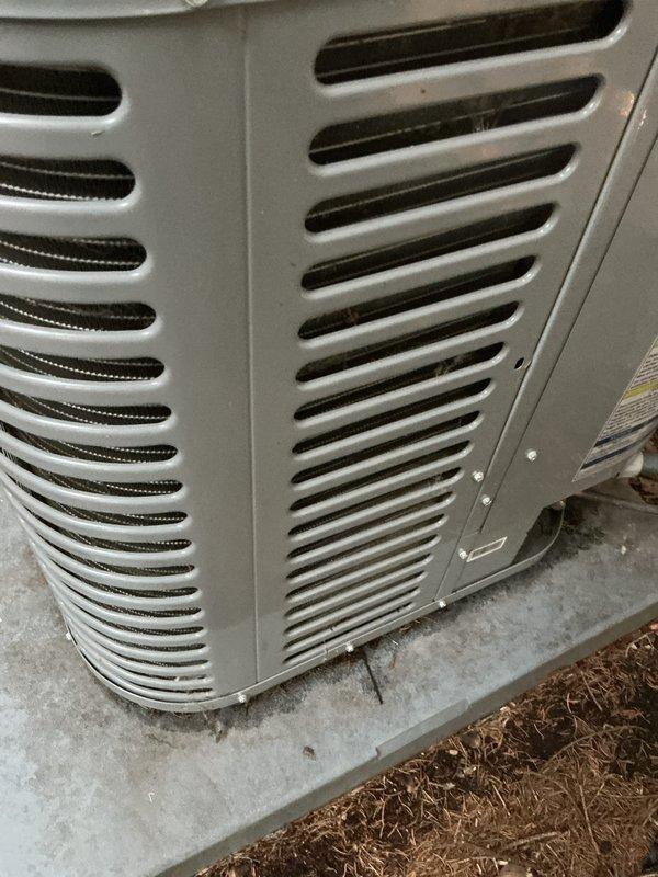 Completed comprehensive spring tune-up on residential air conditioning system. Performed full system inspection of outdoor condenser unit, which appeared to be in good working condition with minor dirt accumulation on exterior cabinet and ventilation louvers. Checked refrigerant levels, electrical connections, and amperage draws on compressor and condenser fan motor. Cleaned condenser coils to remove debris and ensure optimal heat transfer efficiency. Verified proper operation of contactor, capacitor, and all safety controls. Inspected concrete pad for levelness and stability. Tested system startup and shutdown sequences, confirmed adequate airflow through louvered cabinet panels, and verified unit was operating within manufacturer specifications. System is ready for cooling season.
