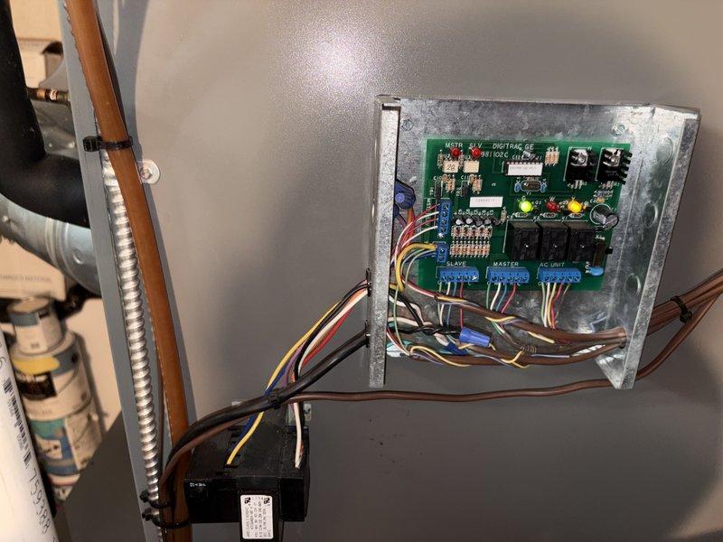 Responded to service call for non-operational outdoor A/C unit displaying error codes. Upon inspection, accessed the electrical control board and DIGIRAC GE control system to diagnose the fault. Evaluated the wiring connections, relay functions, and circuit board components including the master and slave terminal blocks. Identified and resolved the issue causing the system malfunction, verified proper operation of all electrical connections and control sequences, and restored the air conditioning unit to normal working condition.