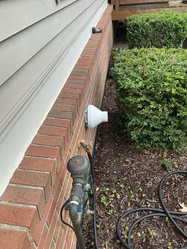 Completed air conditioning system installation and performed initial start-up procedures. Installed condensate drain line with proper P-trap configuration and exterior discharge piping, ensuring adequate drainage and code compliance. Verified all refrigerant connections, tested system operation, and confirmed proper cooling function upon start-up.