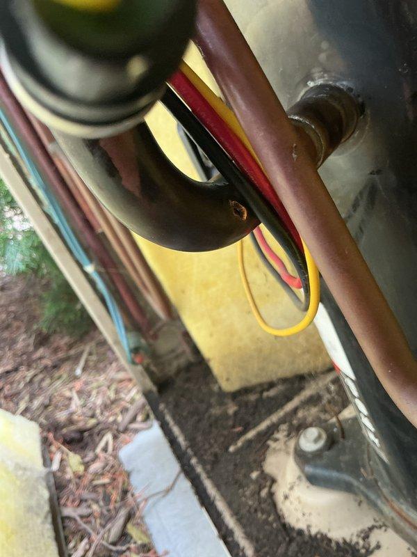 Responded to no cooling complaint on 20+ year old residential air conditioning system. Performed diagnostic inspection of outdoor condensing unit and associated electrical components. Documented existing equipment condition with photos showing aged wiring connections, refrigerant lines, and exterior condenser unit with significant wear. Discussed repair versus replacement options with customer, who scheduled follow-up appointment for further evaluation and potential system replacement.
