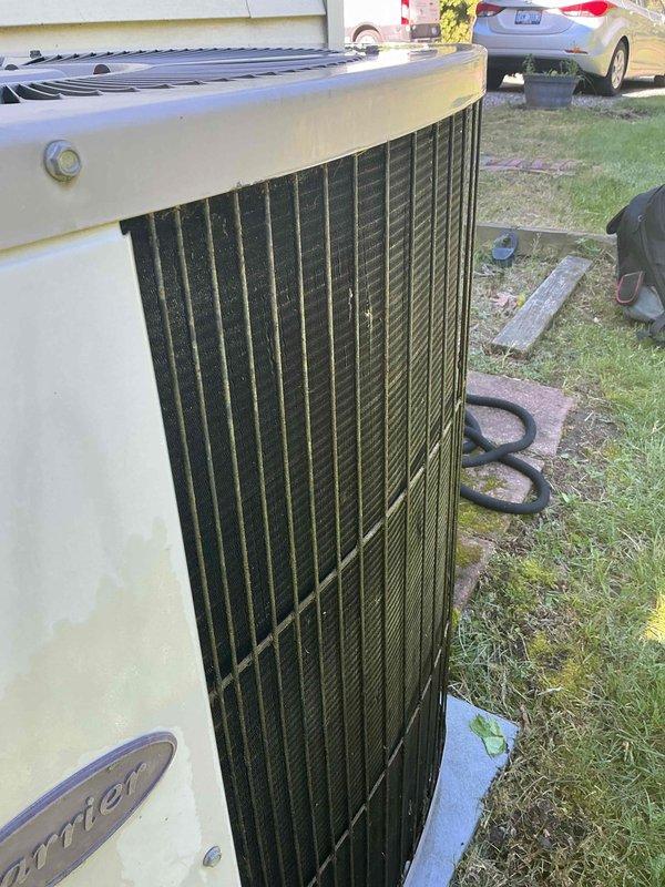 Completed scheduled air conditioning tune-up and preventative maintenance on residential outdoor condenser unit. Performed comprehensive system inspection, cleaned condenser coils showing significant dirt and debris accumulation on vertical fins, verified proper operation of all components, and ensured unit was functioning efficiently for the cooling season.