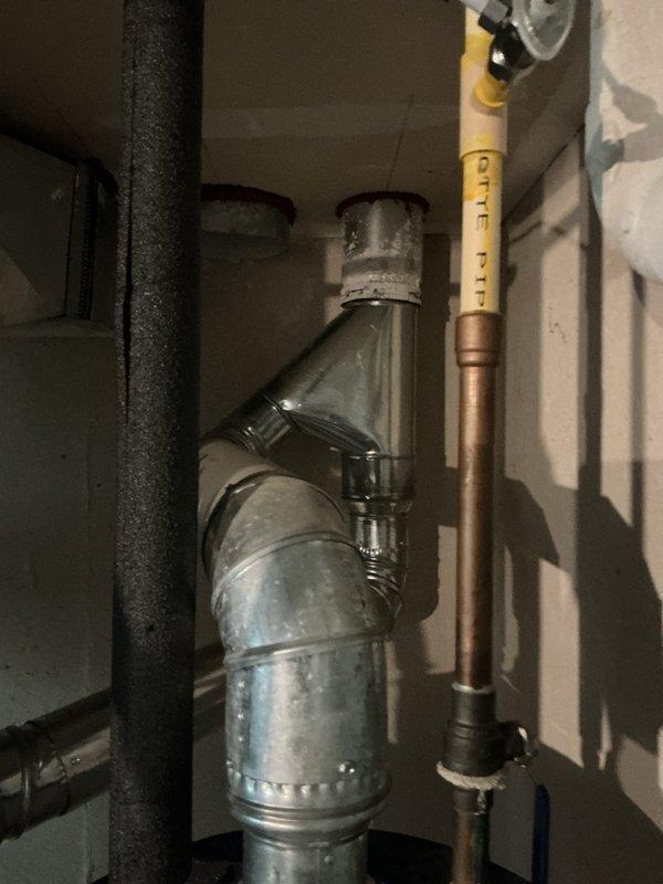 Completed installation of gas furnace system in basement utility area. Installed new furnace unit with proper venting using white PVC piping, configured exhaust system with appropriate elbow joints for horizontal discharge, and connected gas supply line with clearly marked identification. All components secured according to manufacturer specifications and local building codes.
