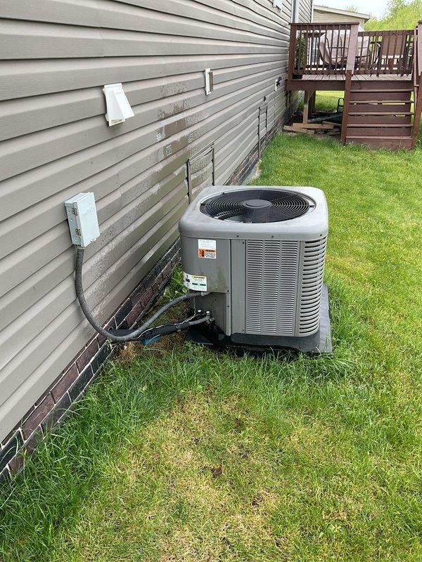 Completed routine maintenance and tune-up on an eight-year-old residential air conditioning system. Performed comprehensive inspection of outdoor condenser unit, verified proper refrigerant line connections, checked electrical conduit and junction box for secure mounting, and confirmed unit operational status. No issues or deficiencies were identified during the service visit.